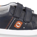 Navy blue color OKAA FLEX tennis kids shoes laceless combined with tan color.