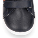 Navy blue color OKAA FLEX tennis kids shoes laceless combined with tan color.