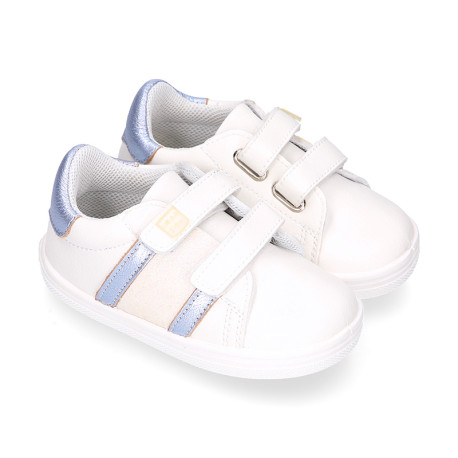 White color OKAA FLEX girl tennis shoes laceless with silver color stripes design.