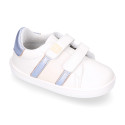 White color OKAA FLEX girl tennis shoes laceless with silver color stripes design.