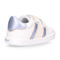 White color OKAA FLEX girl tennis shoes laceless with silver color stripes design.