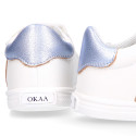 White color OKAA FLEX girl tennis shoes laceless with silver color stripes design.