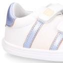 White color OKAA FLEX girl tennis shoes laceless with silver color stripes design.