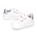 White color OKAA FLEX girl tennis shoes laceless with silver color stripes design.
