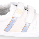 White color OKAA FLEX girl tennis shoes laceless with silver color stripes design.