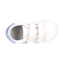 White color OKAA FLEX girl tennis shoes laceless with silver color stripes design.