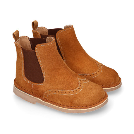 Suede leather ankle boots with elastic band and chopped design in TAN color.