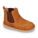 Suede leather ankle boots with elastic band and chopped design in TAN color.