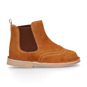 Suede leather ankle boots with elastic band and chopped design in TAN color.