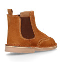 Suede leather ankle boots with elastic band and chopped design in TAN color.