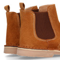 Suede leather ankle boots with elastic band and chopped design in TAN color.