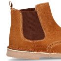 Suede leather ankle boots with elastic band and chopped design in TAN color.