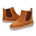 Suede leather ankle boots with elastic band and chopped design in TAN color.