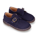 Suede leather Oxford shoes with buckle fastening for kids.