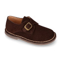 Suede leather Oxford shoes with buckle fastening for kids.