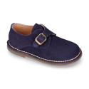 Suede leather Oxford shoes with buckle fastening for kids.