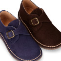 Suede leather Oxford shoes with buckle fastening for kids.