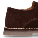 Suede leather Oxford shoes with buckle fastening for kids.