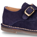 Suede leather Oxford shoes with buckle fastening for kids.