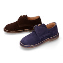 Suede leather Oxford shoes with buckle fastening for kids.