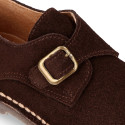 Suede leather Oxford shoes with buckle fastening for kids.