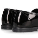 Stylized Girl OKAA Moccasin shoes in BLACK PATENT finish.