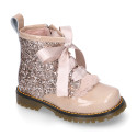 ROCK style patent leather kids boots with GLITTER and fur design and ties closure.