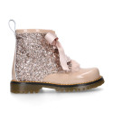 ROCK style patent leather kids boots with GLITTER and fur design and ties closure.