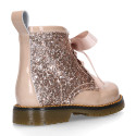 ROCK style patent leather kids boots with GLITTER and fur design and ties closure.