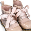 ROCK style patent leather kids boots with GLITTER and fur design and ties closure.