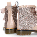 ROCK style patent leather kids boots with GLITTER and fur design and ties closure.