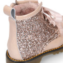 ROCK style patent leather kids boots with GLITTER and fur design and ties closure.