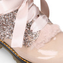 ROCK style patent leather kids boots with GLITTER and fur design and ties closure.