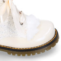 ROCK style patent leather kids boots with GLITTER and fur design and ties closure in IVORY color.