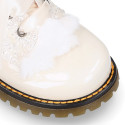 ROCK style patent leather kids boots with GLITTER and fur design and ties closure in IVORY color.