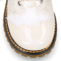 ROCK style patent leather kids boots with GLITTER and fur design and ties closure in IVORY color.