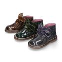 Girl GLITTER and pearl patent leather safari boots with velvet ties closure.