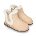 Suede leather kids ankle boot shoes with elastic and lining design in faux fur.