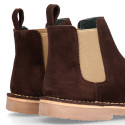 Kids ankle boots with elastic band in suede leather in BROWN color.