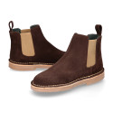 Kids ankle boots with elastic band in suede leather in BROWN color.