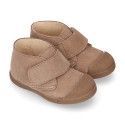 Suede leather Kids ankle boots laceless and with toe cap design.