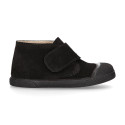 Suede leather Kids ankle boots laceless and with toe cap design.