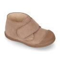 Suede leather Kids ankle boots laceless and with toe cap design.