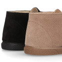 Suede leather Kids ankle boots laceless and with toe cap design.