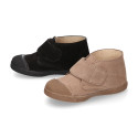 Suede leather Kids ankle boots laceless and with toe cap design.