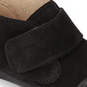 Suede leather Kids ankle boots laceless and with toe cap design.