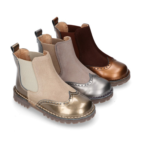 Combined leather kids ankle boots with elastic band and thick outsole.