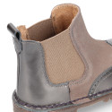 Combined leather kids ankle boots with elastic band and thick outsole.