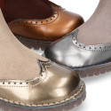 Combined leather kids ankle boots with elastic band and thick outsole.