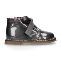 Girl Safari Boots with silk laces closure and waves in PEARL patent leather.